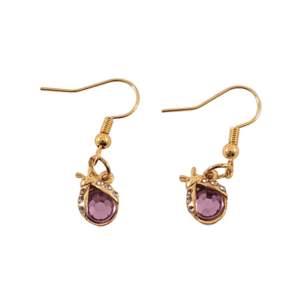 Pair of gold earrings with purple gemstones shaped like ladybugs